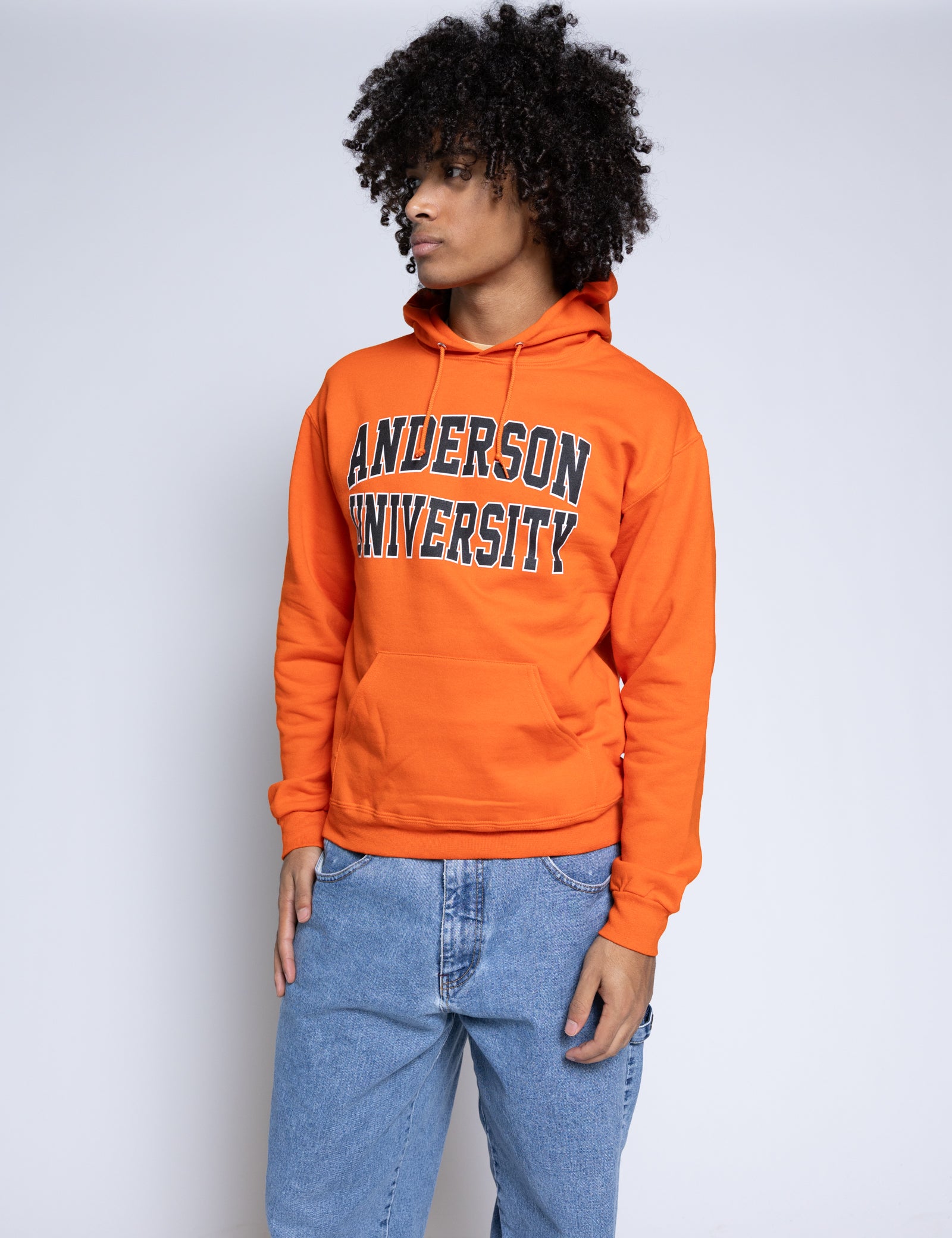 Person wearing an orange 'Anderson University' hoodie against a plain background