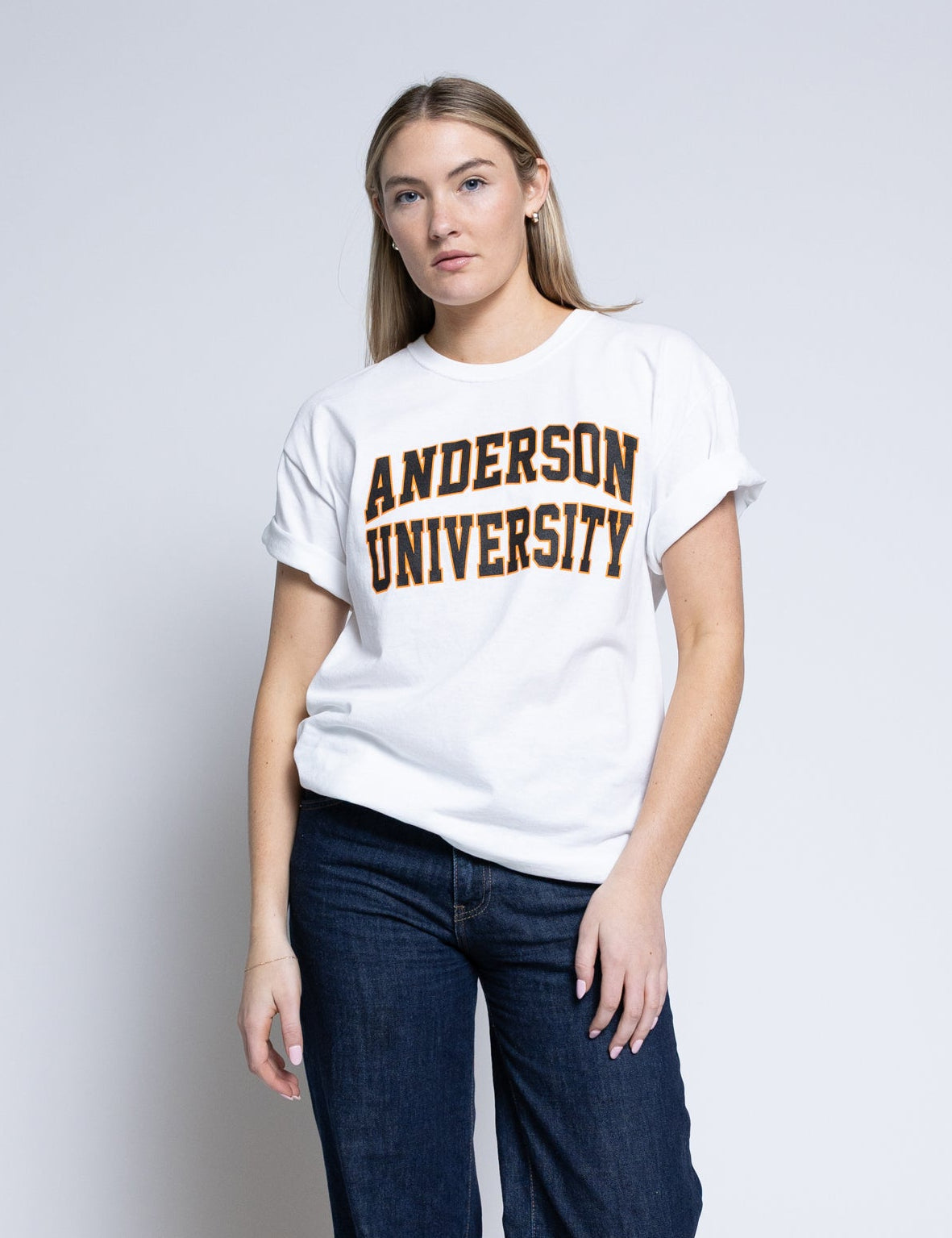 Person wearing a white t-shirt with 'Anderson University' printed on it against a plain background