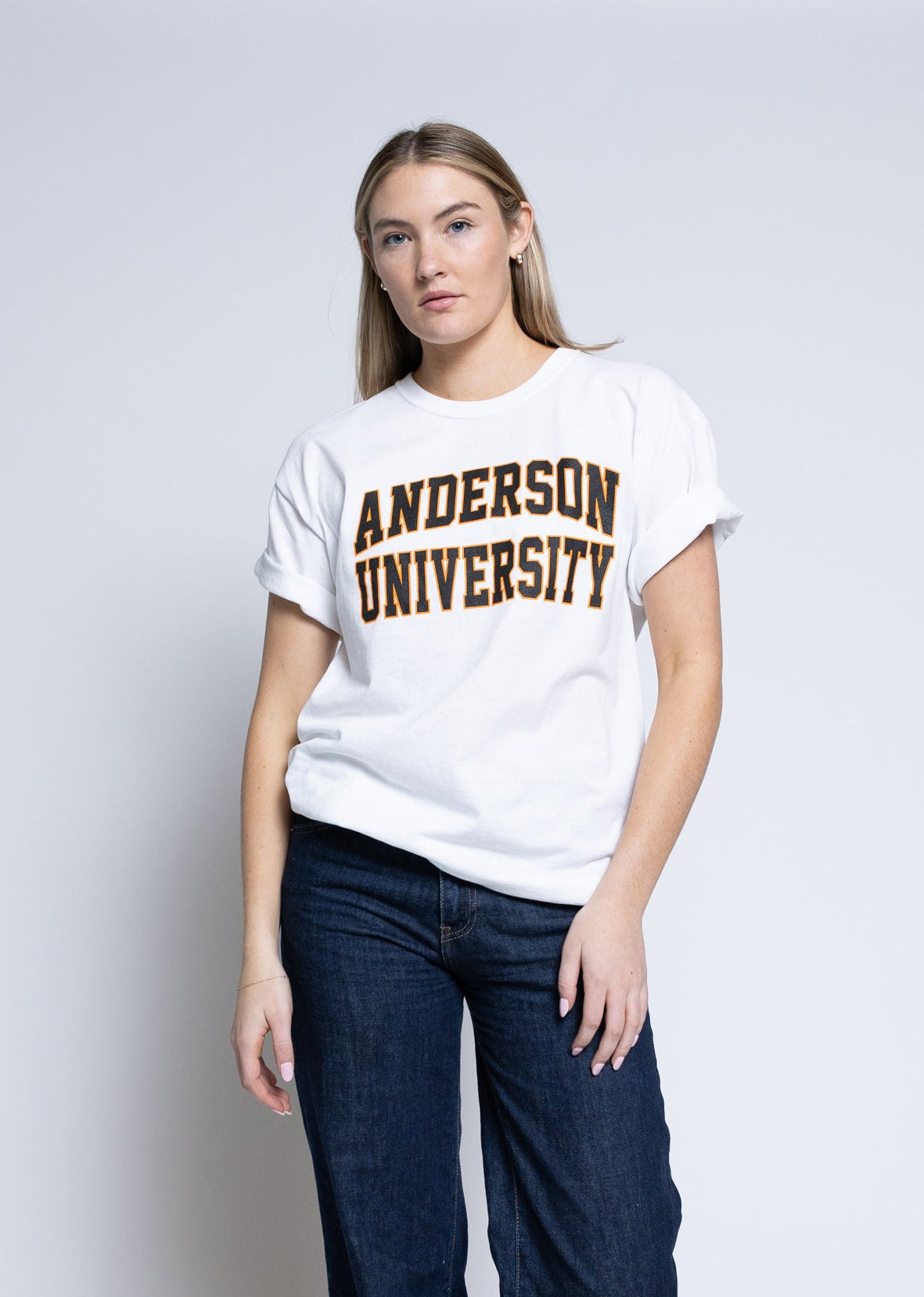 Person wearing a white t-shirt with 'Anderson University' printed on it against a plain background
