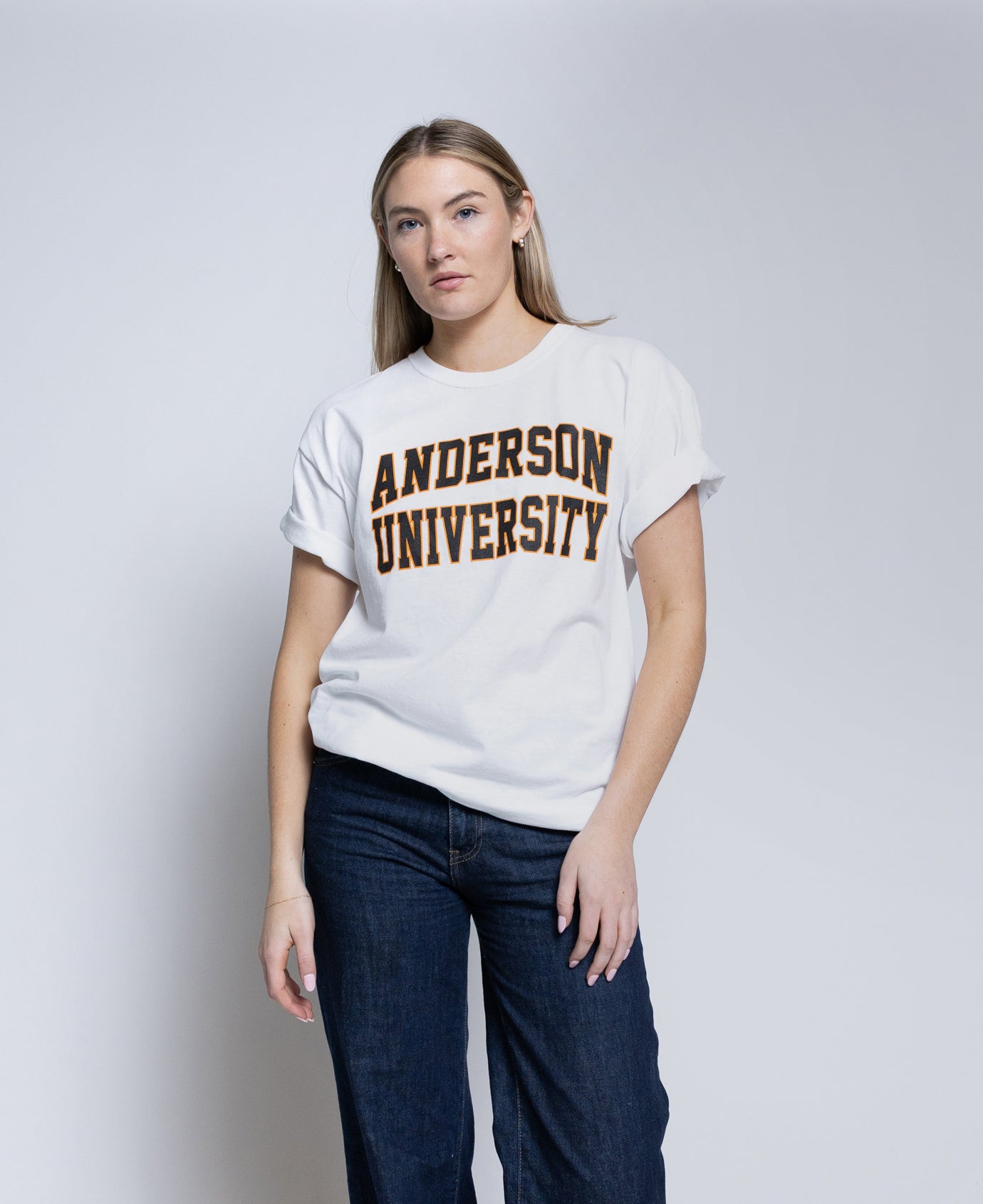 Woman wearing a white t-shirt with 'Anderson University' text on a plain background