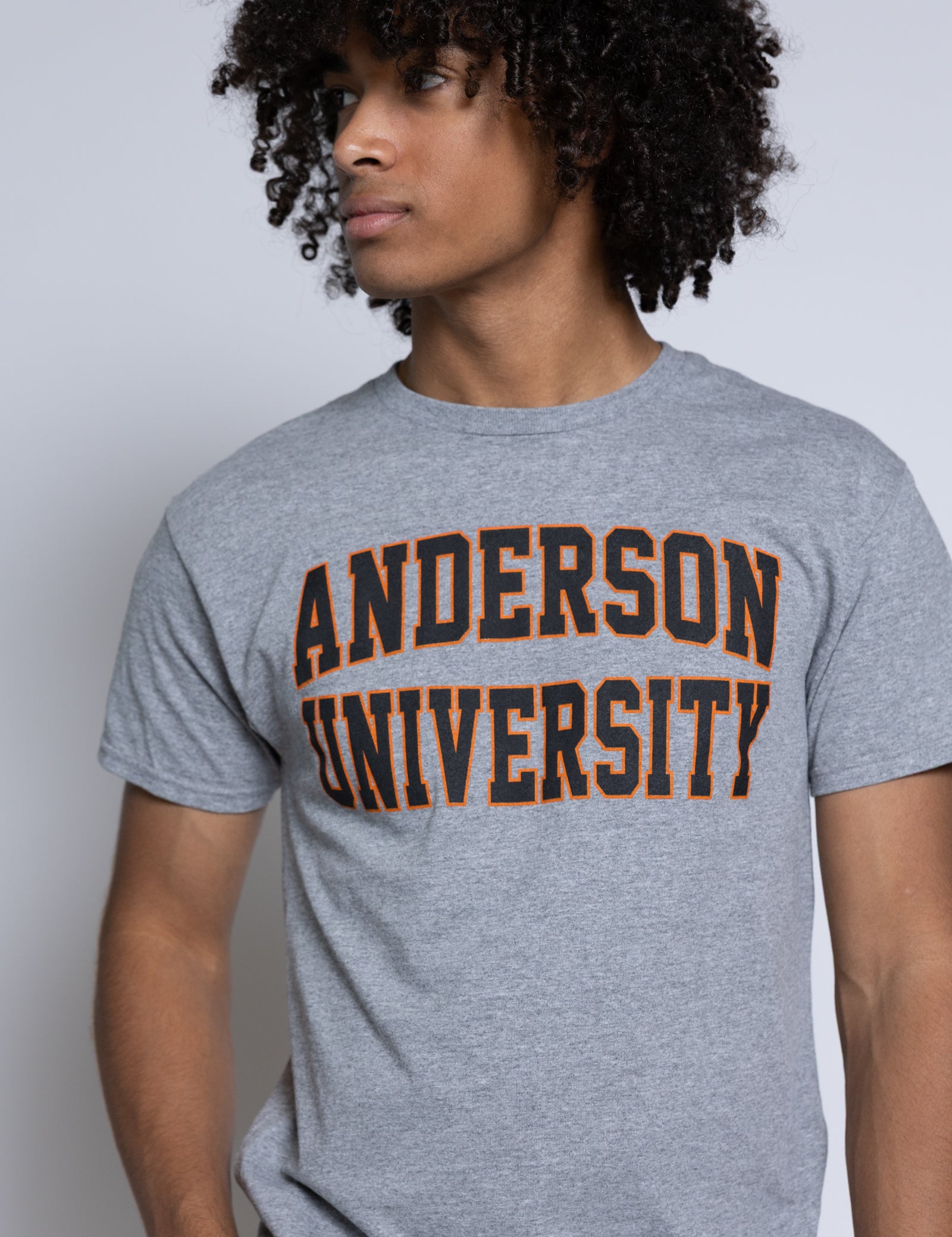 Person wearing a gray 'Anderson University' t-shirt against a plain background