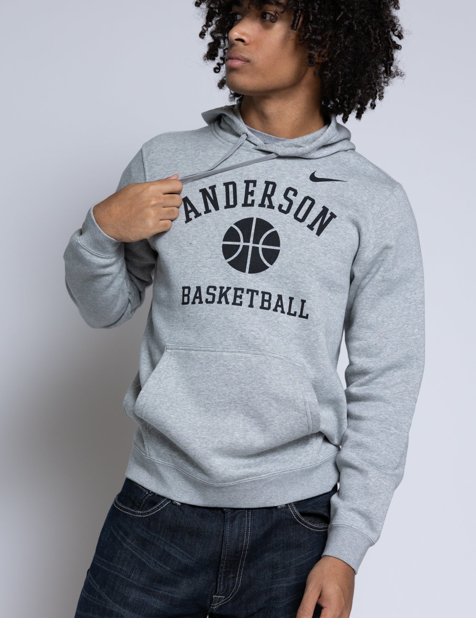 Person wearing a gray hoodie with 'Anderson Basketball' text and Nike logo.
