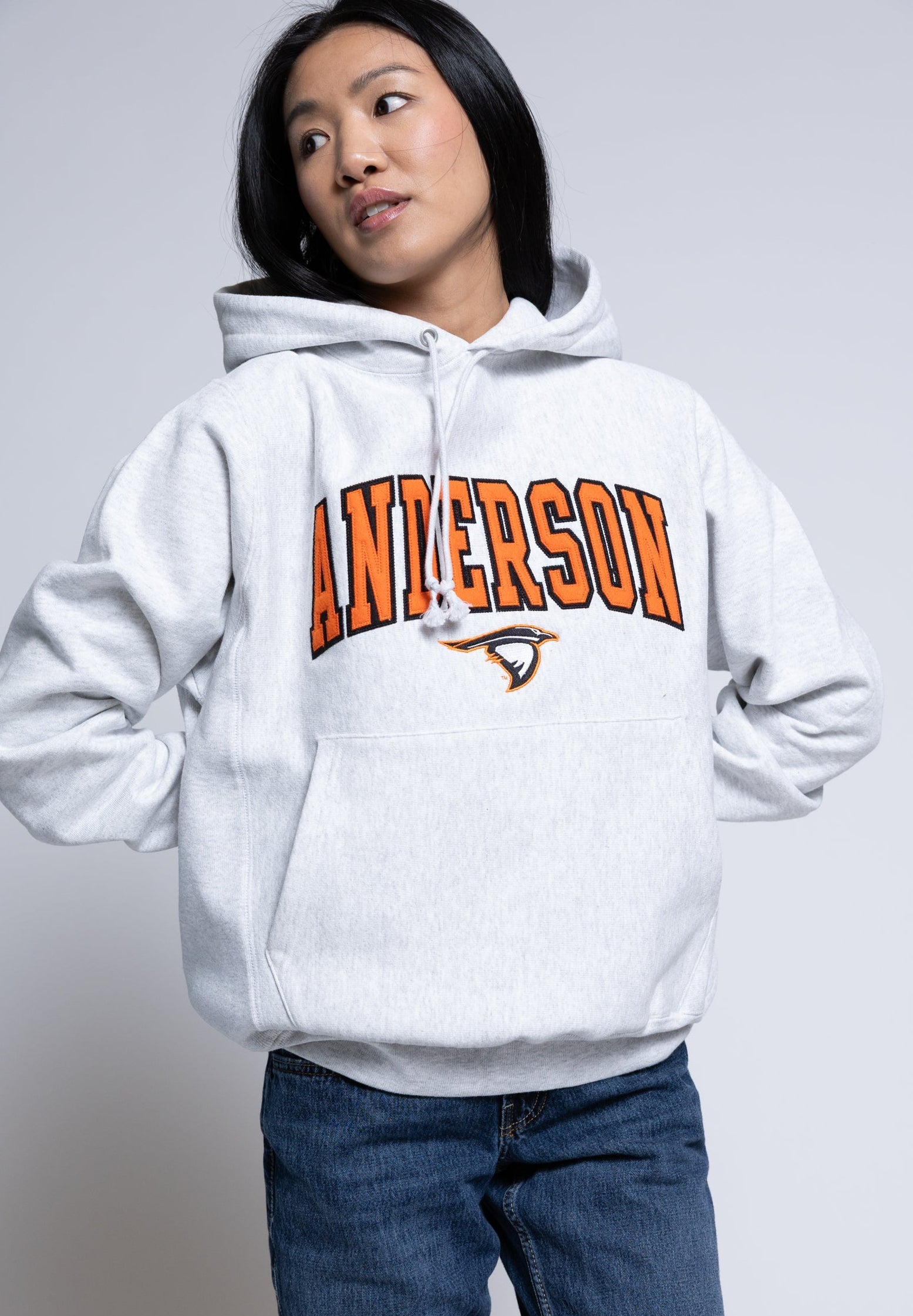 Person wearing a hoodie with 'Anderson' printed on it against a plain background