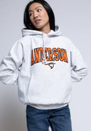 Person wearing a hoodie with 'Anderson' printed on it against a plain background
