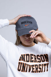 Person wearing a gray cap with 'Anderson' and a white sweatshirt with 'Anderson University' text.