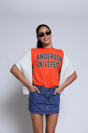 Woman wearing an 'Anderson University' shirt with a plain background